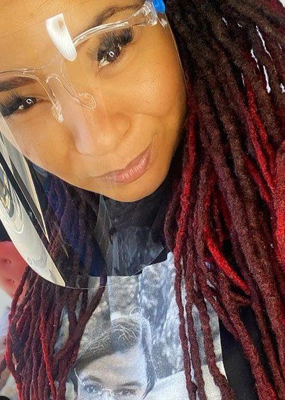 woman with red and black dreadlocks