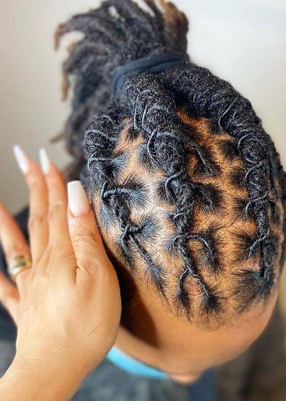 Dreadlocks pulled back in ponytail