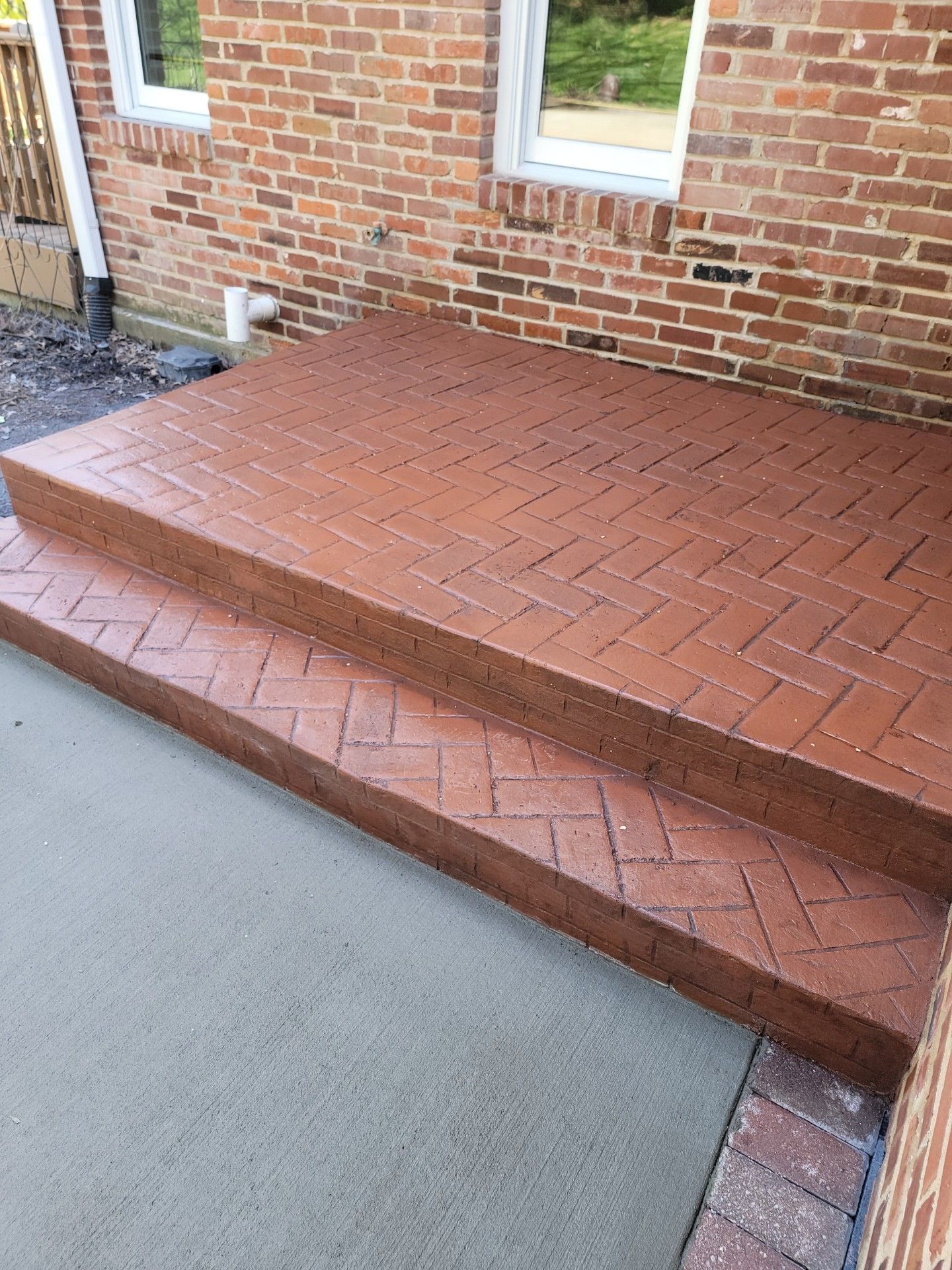 red stamped concrete steps by L & S Concrete STL