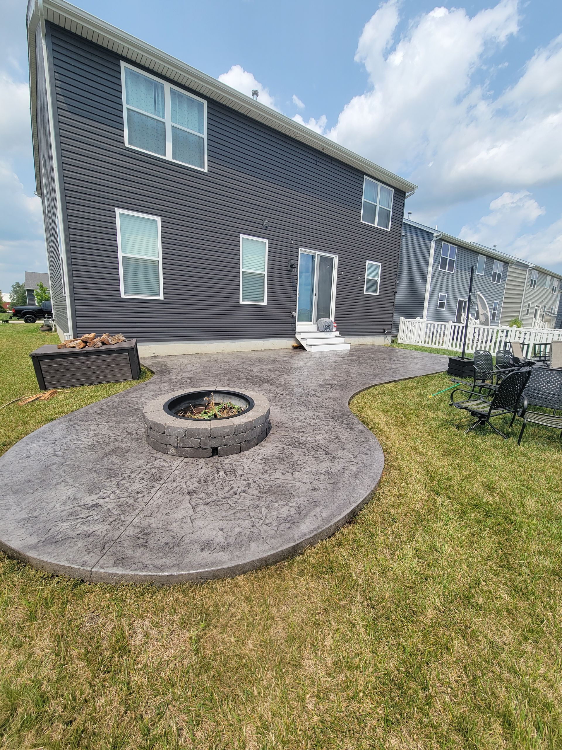 New round, curved stamped patio with firepit L & S Concrete STL
