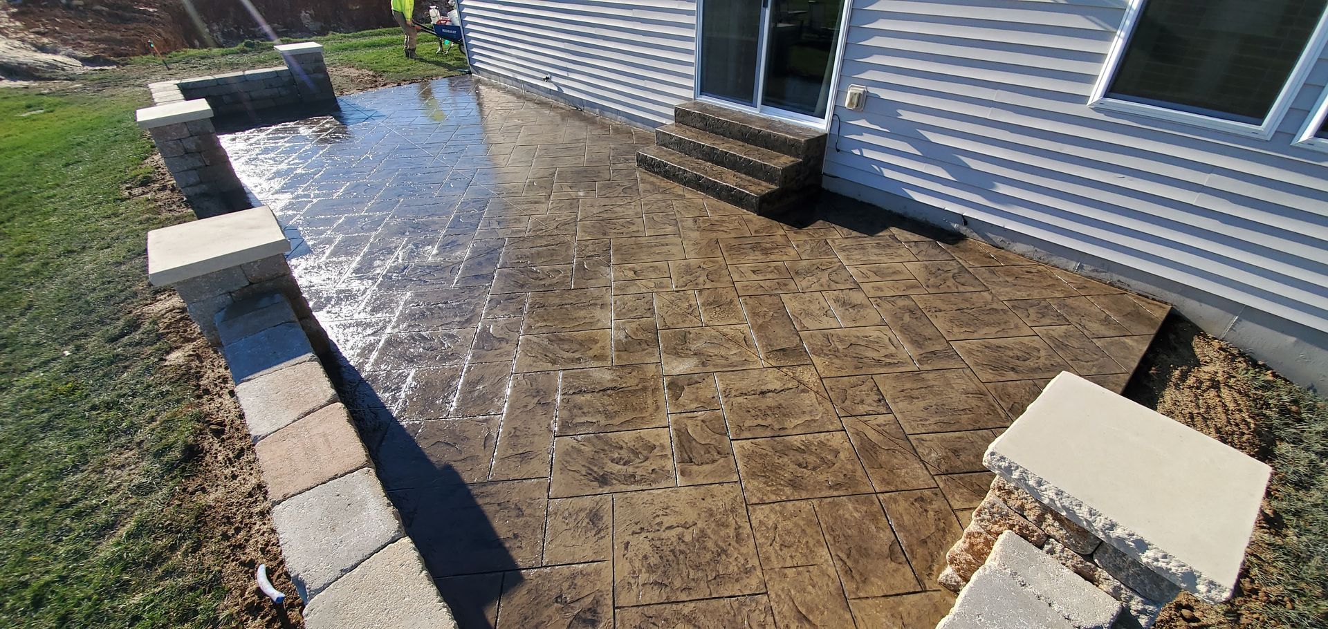 stamped concrete patio with seating wall in O'Fallon MO