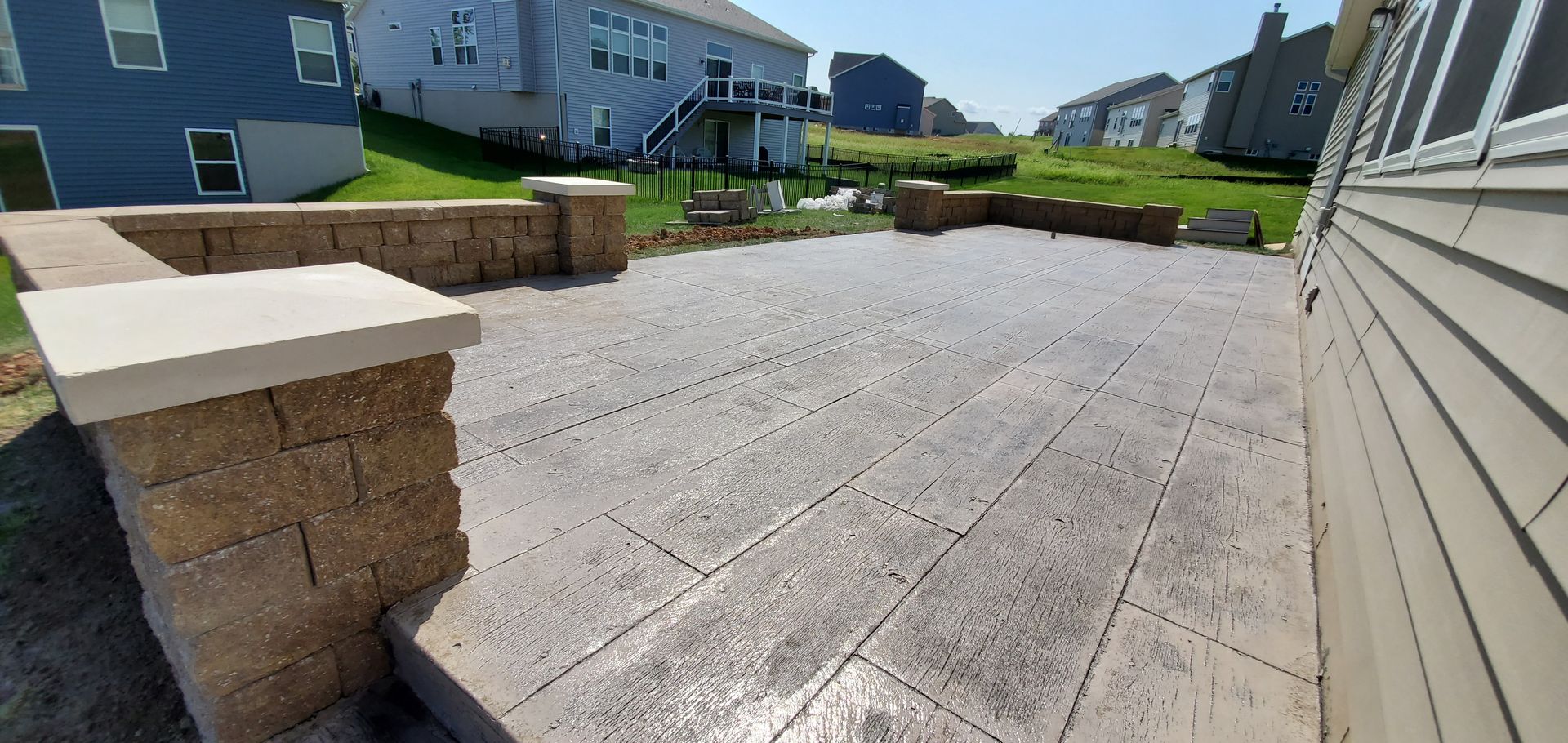 stamped wood patterned concrete with custom seating wall