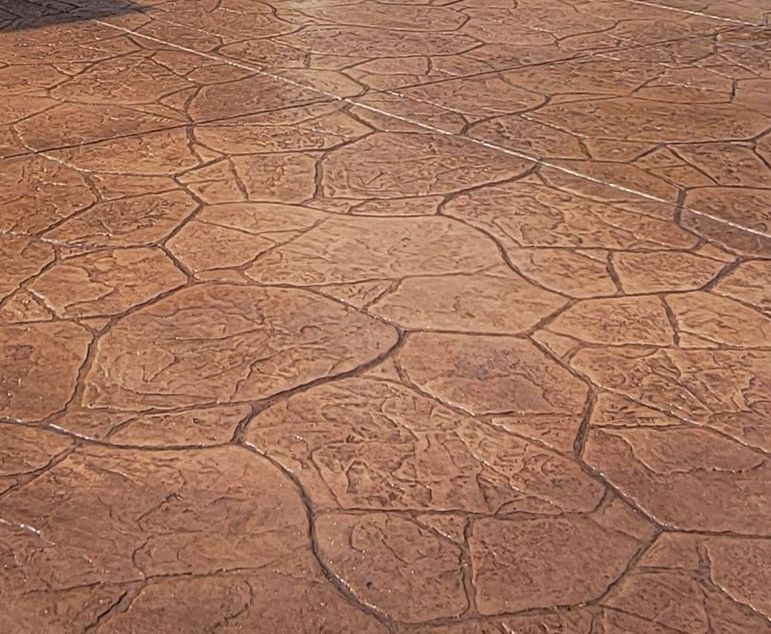 A close up of a concrete floor with a rock pattern.