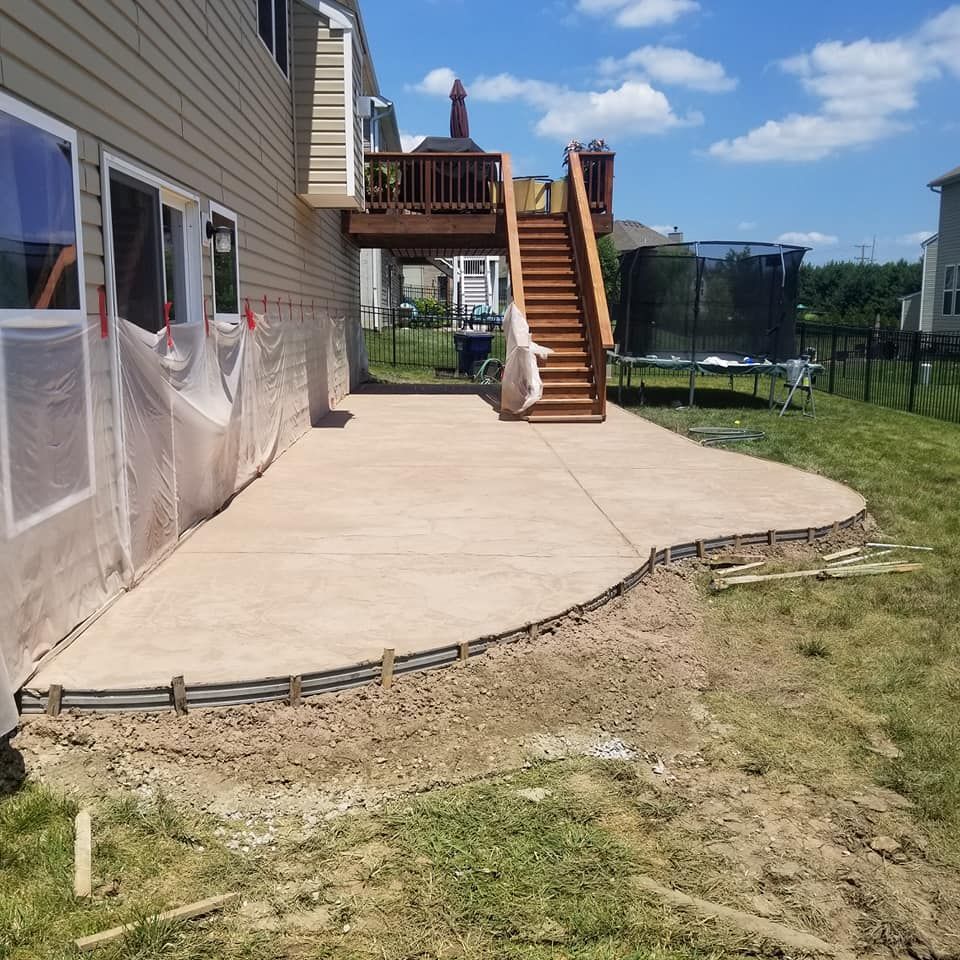 a house with a deck and stairs in the backyard