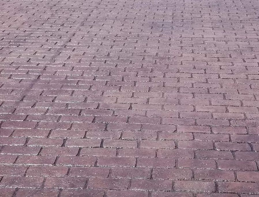 A close up of a brick pavement that looks like a puzzle