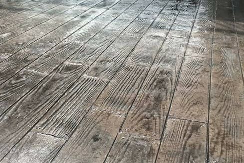 A close up of a concrete floor that looks like wood.