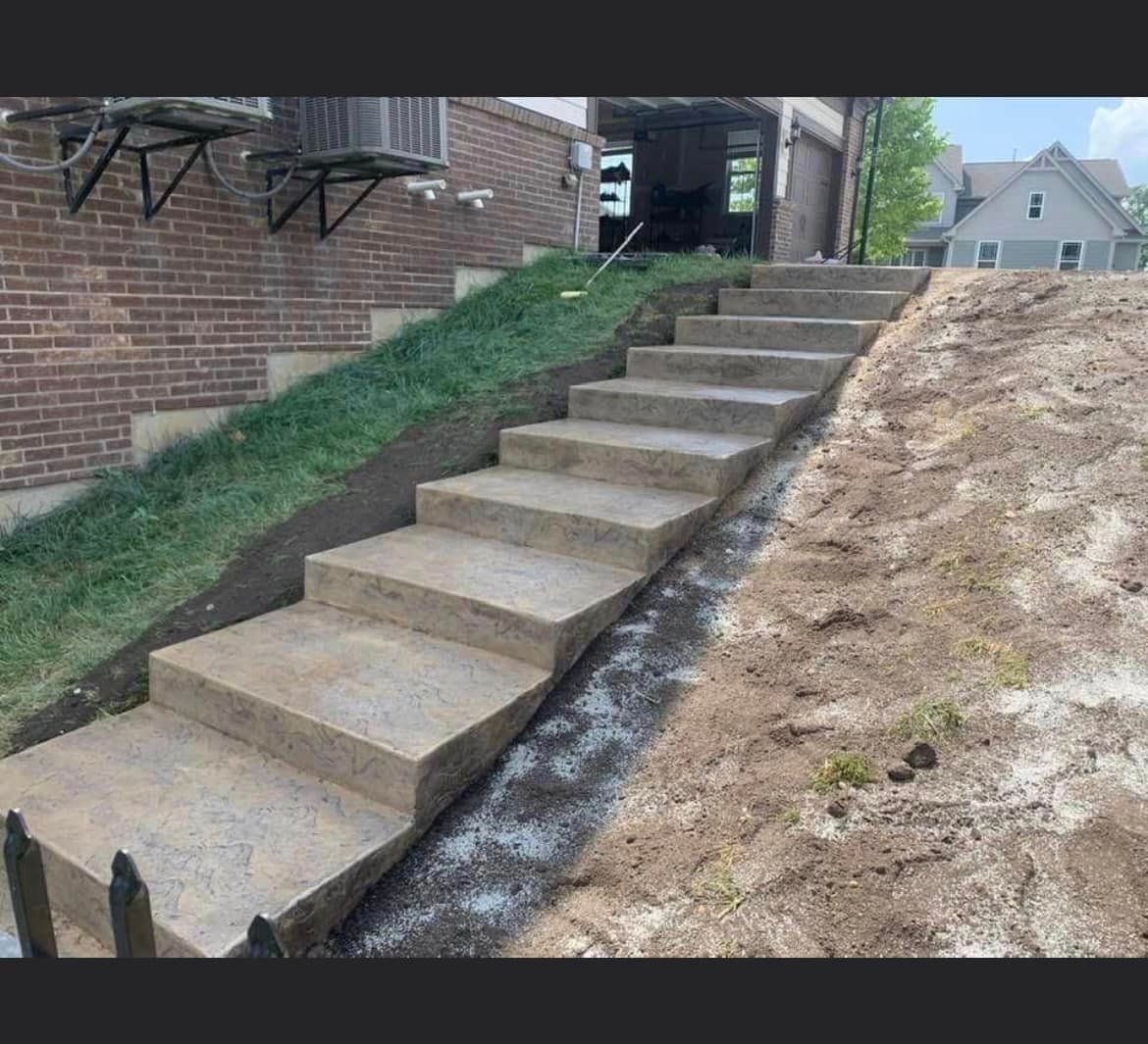 a set of concrete stairs leading up to a house .