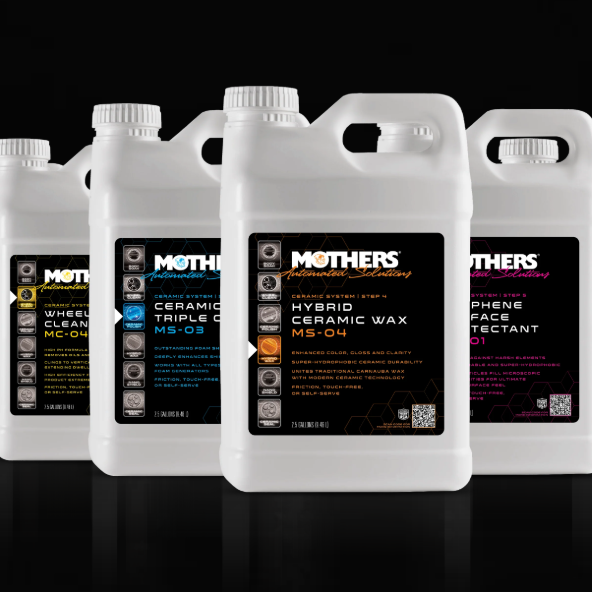 Four white Mothers car care product containers against a black background.
