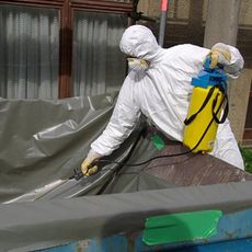 Asbestos Removal Worker in Hazmat Suit