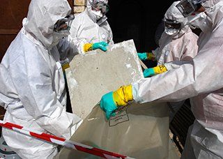Hazmat Workers Disposing of Asbestos