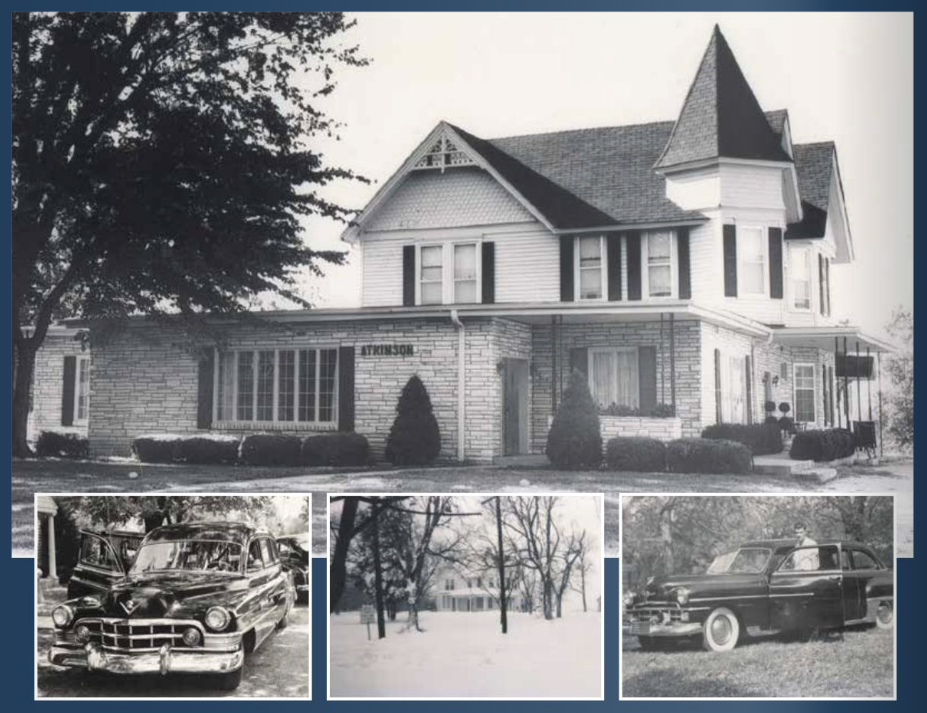 Vintage photo of a two-story building with a tower, a long, low wing. Cars in the foreground.