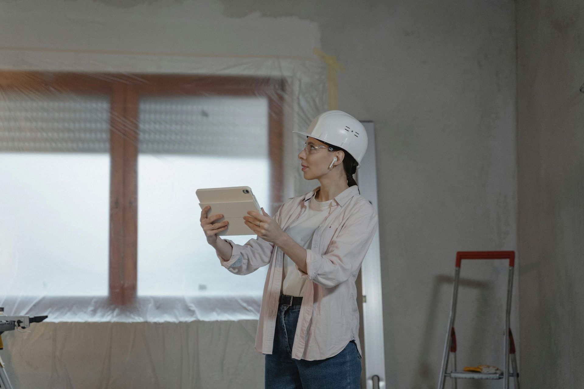 female in hardhat: Sydney brokers help homeowners with renovation loans for home upgrades.