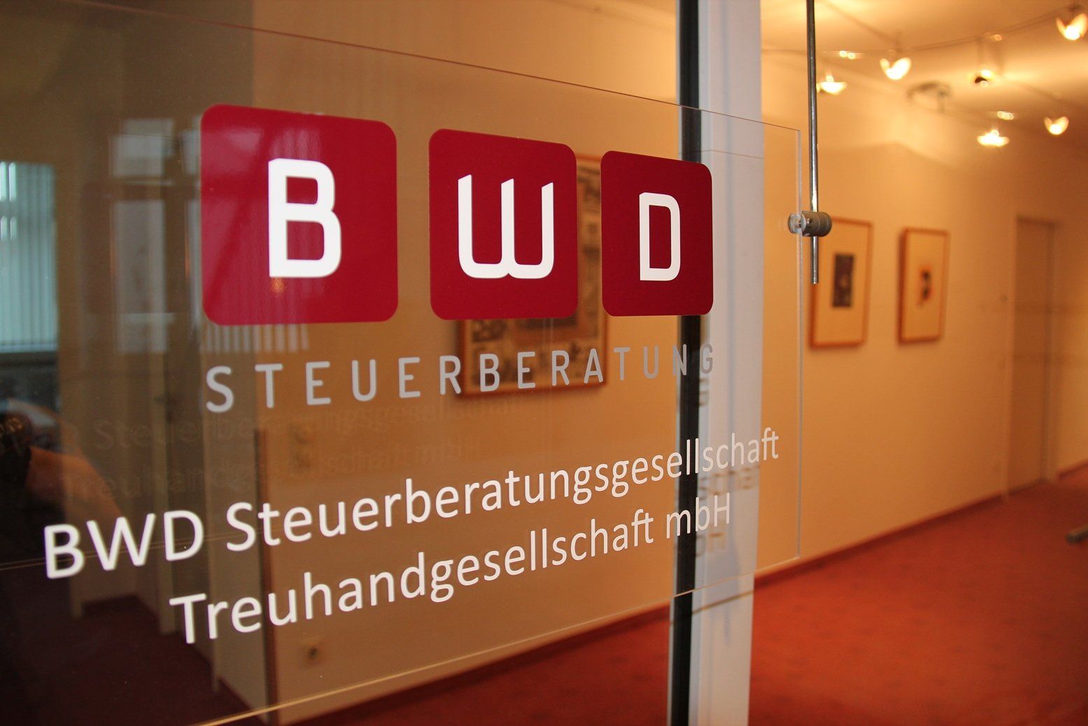 A glass door with bwd written on it