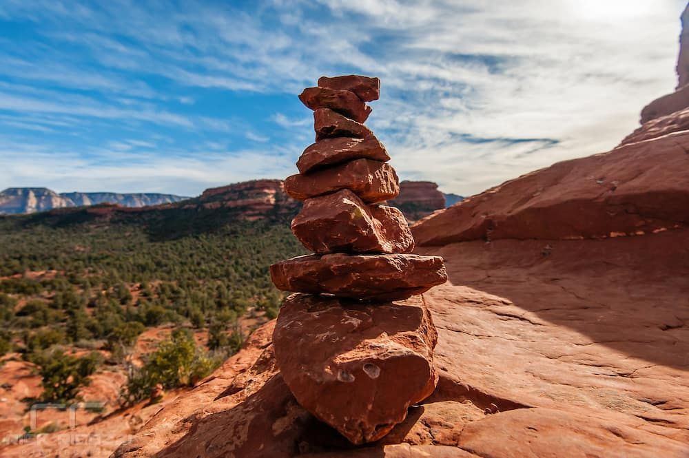 A pile of rocks stacked on top of each other in the desert.