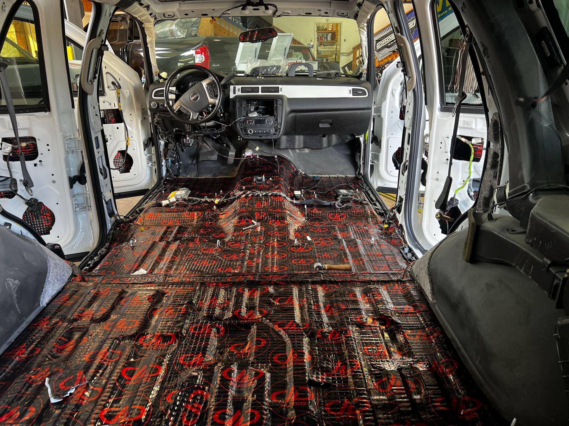The inside of a car with the roof removed and the floor covered in foam.