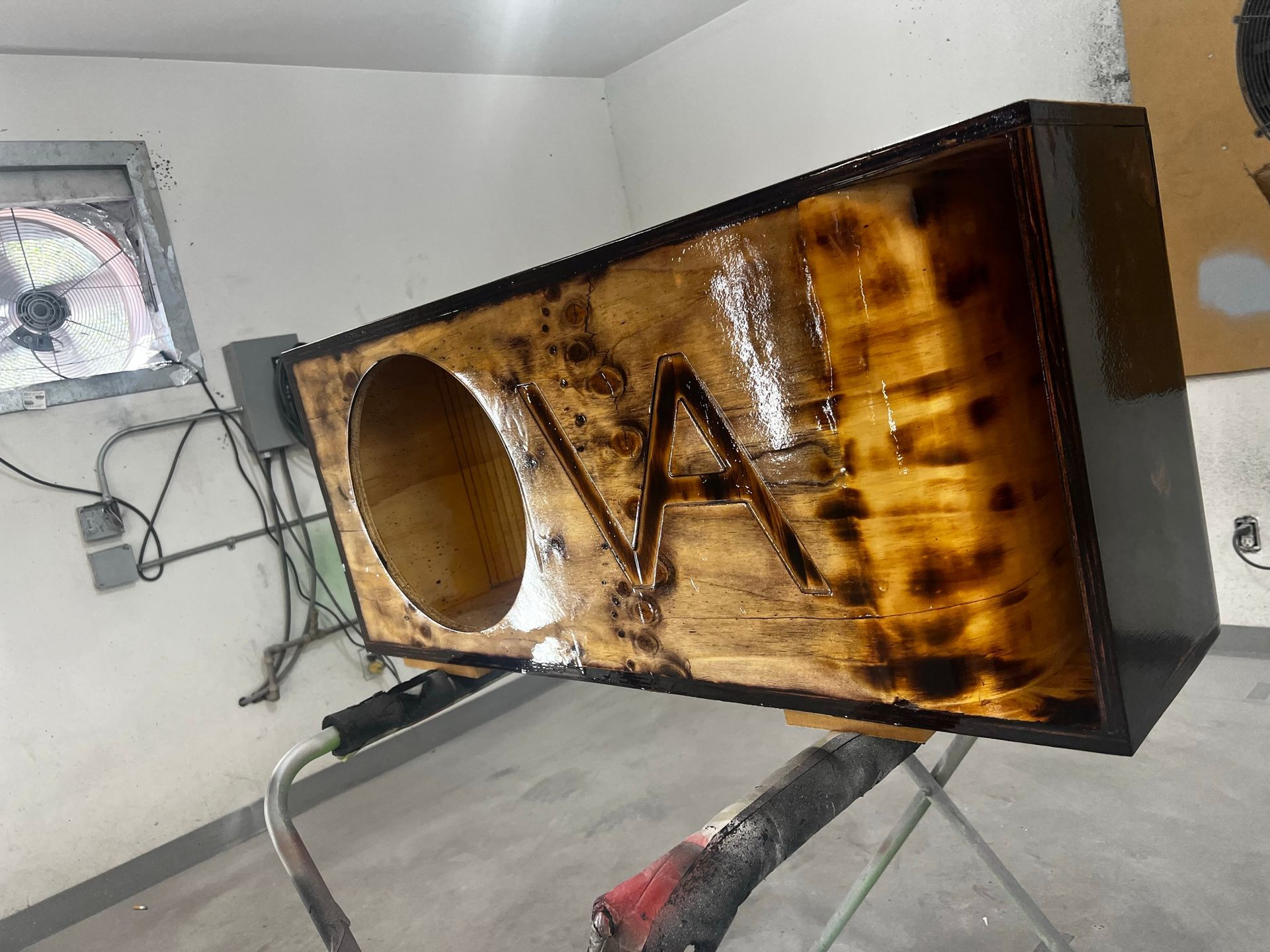 A wooden box is sitting on a table in a room.