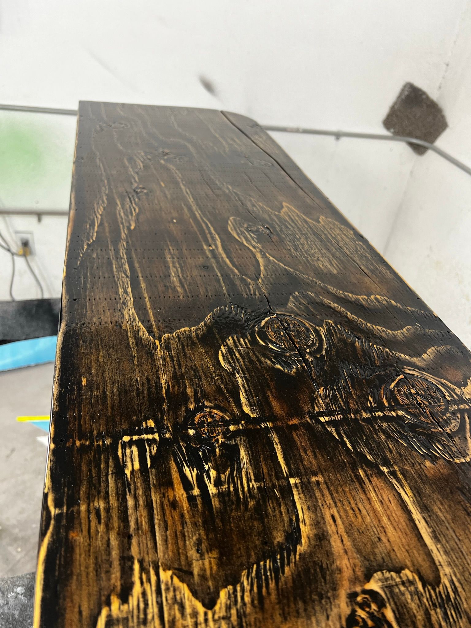 A close up of a piece of wood with a drawing on it.