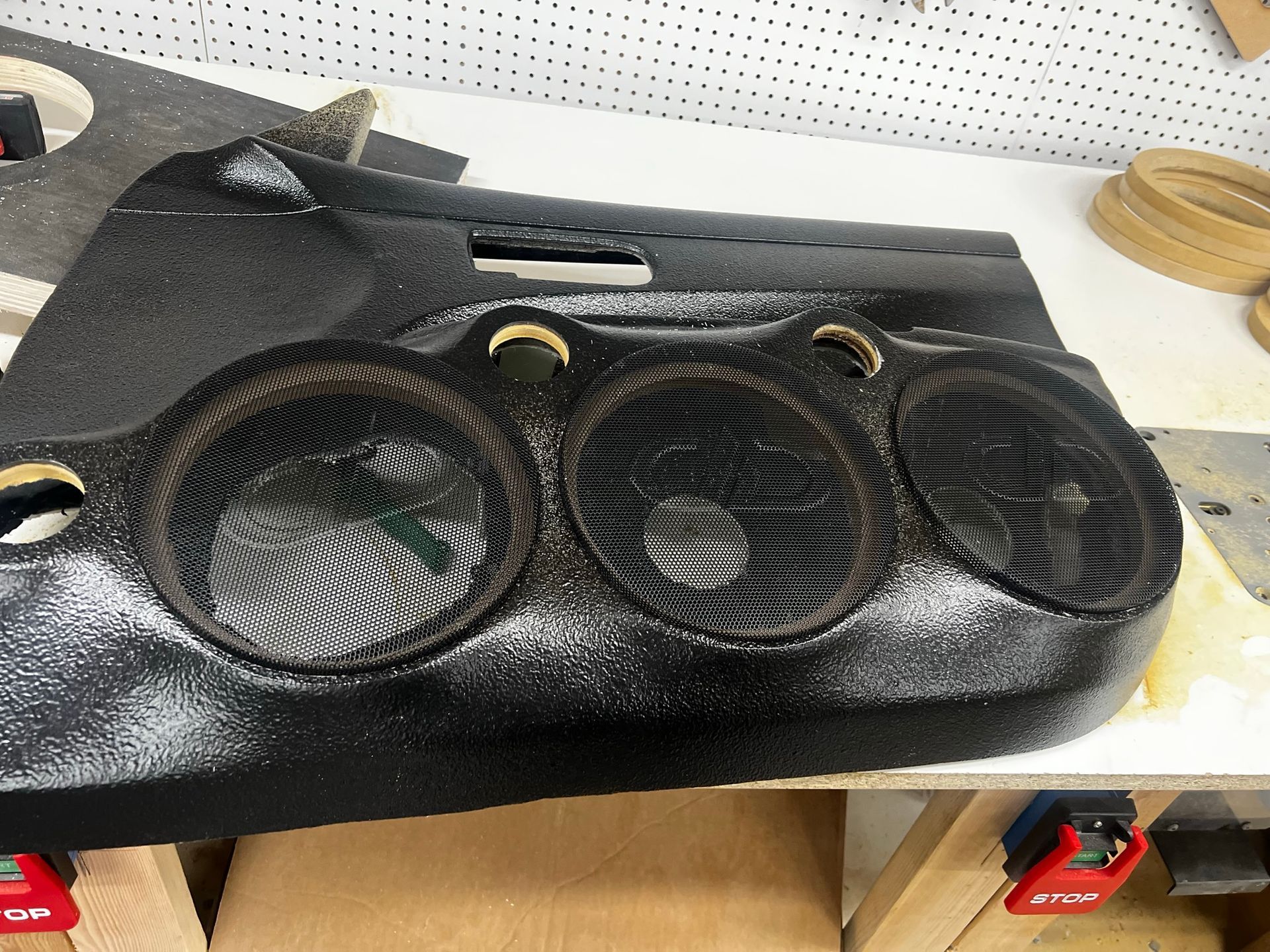 A black object is sitting on top of a wooden table