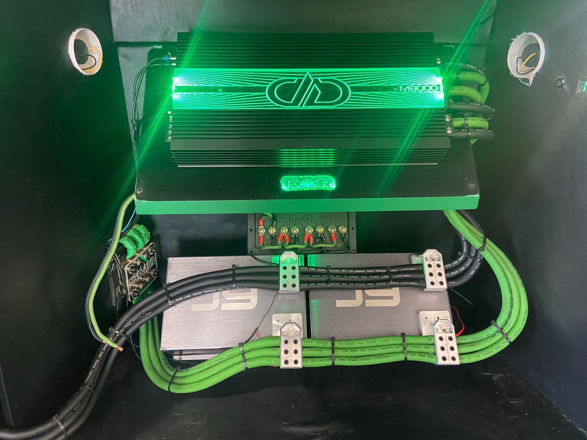 A green light is shining on a black device