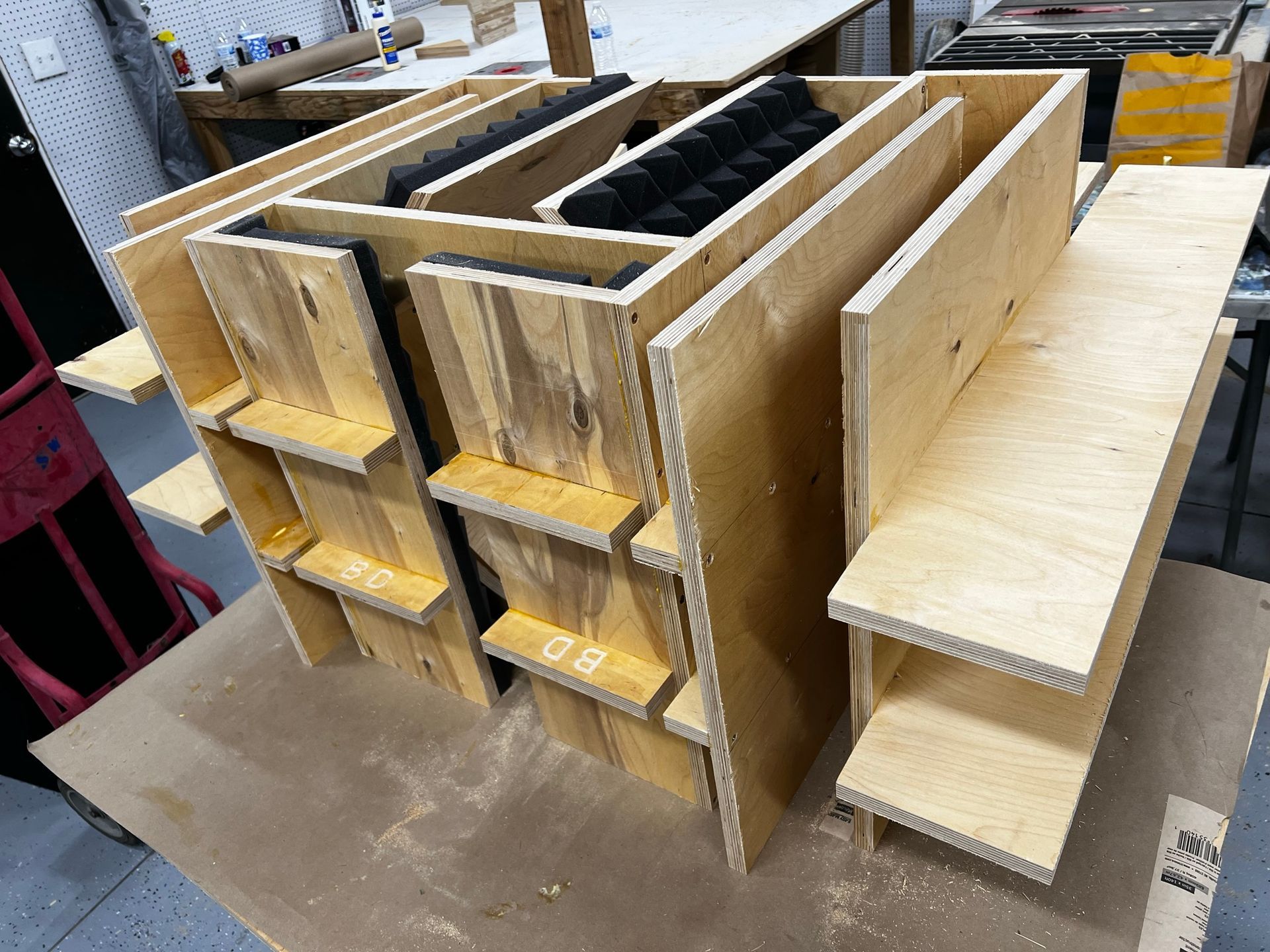 A stack of wooden shelves sitting on top of a wooden table.