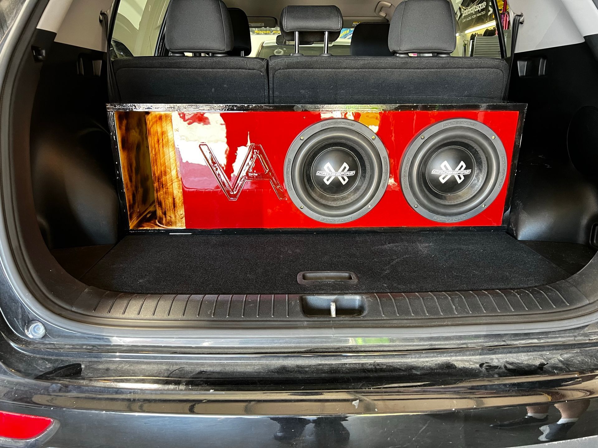 A car with a subwoofer in the back of it