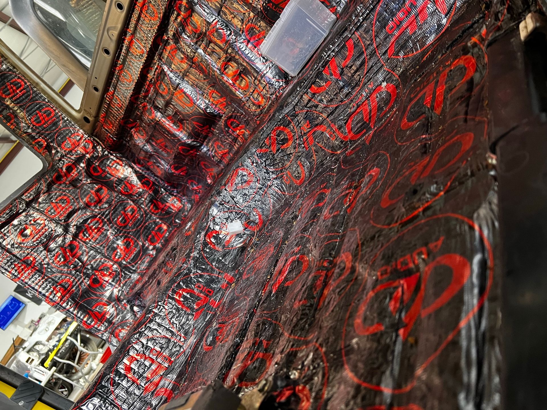 A room with a lot of red and black paint on it