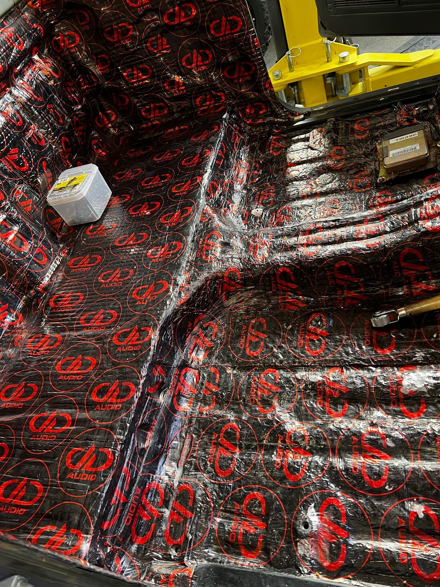 A close up of a piece of foam sitting on top of a car.