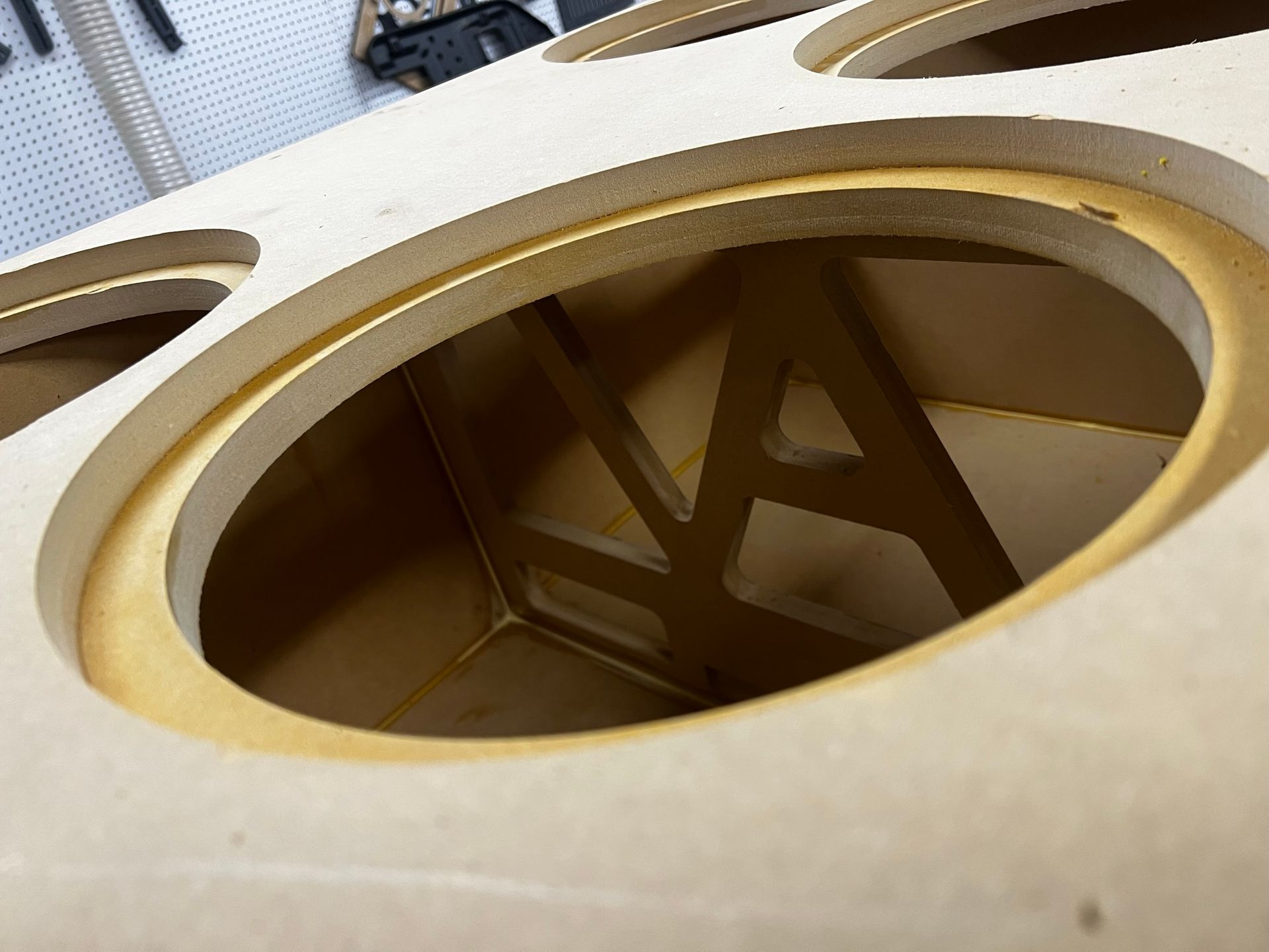 A close up of a wooden box with a hole in the middle