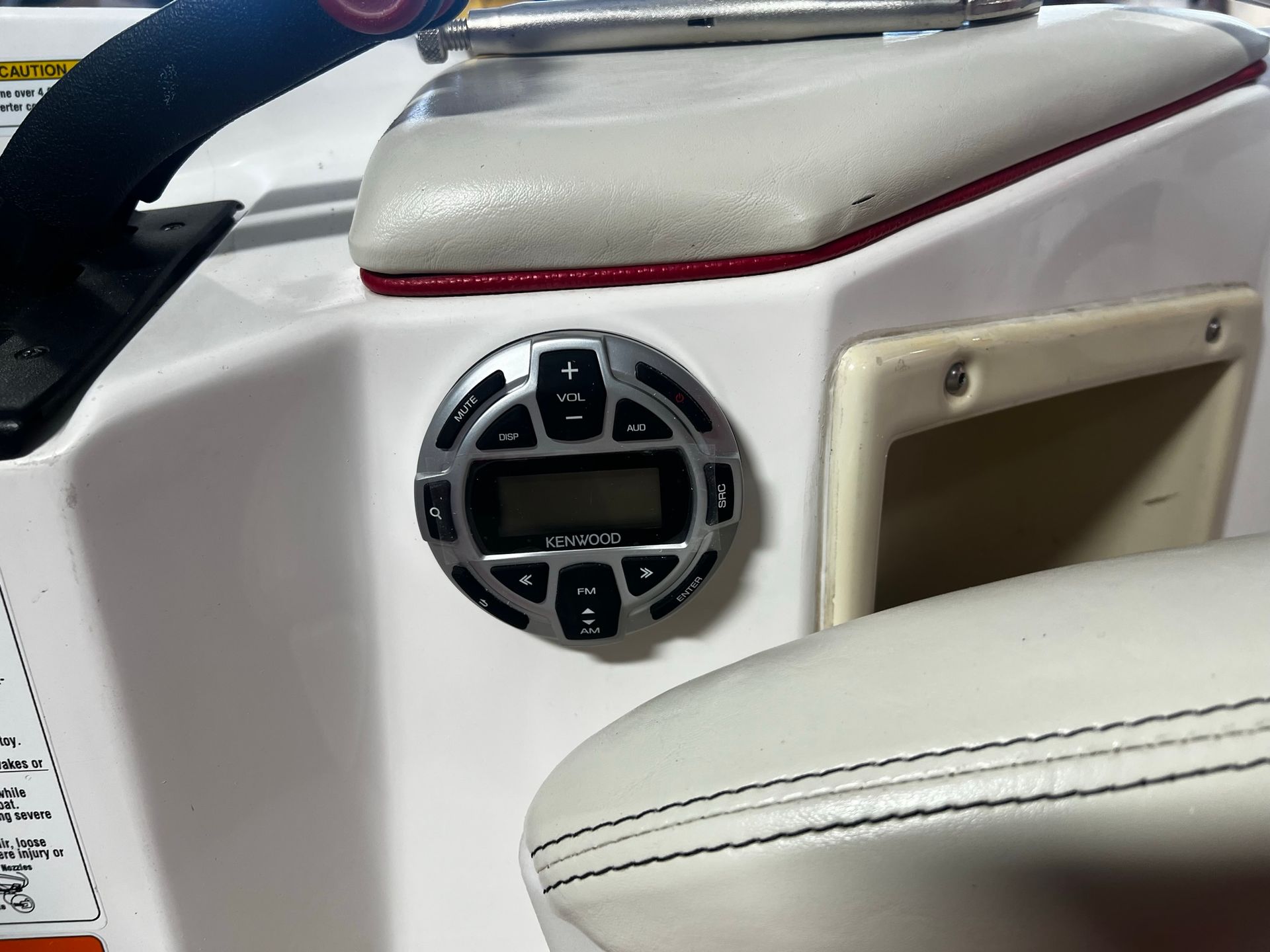 A boat with a radio on the side of it