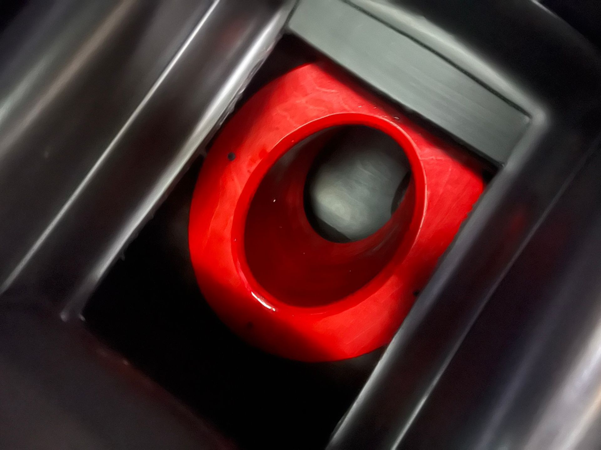 A close up of a red object in a black box