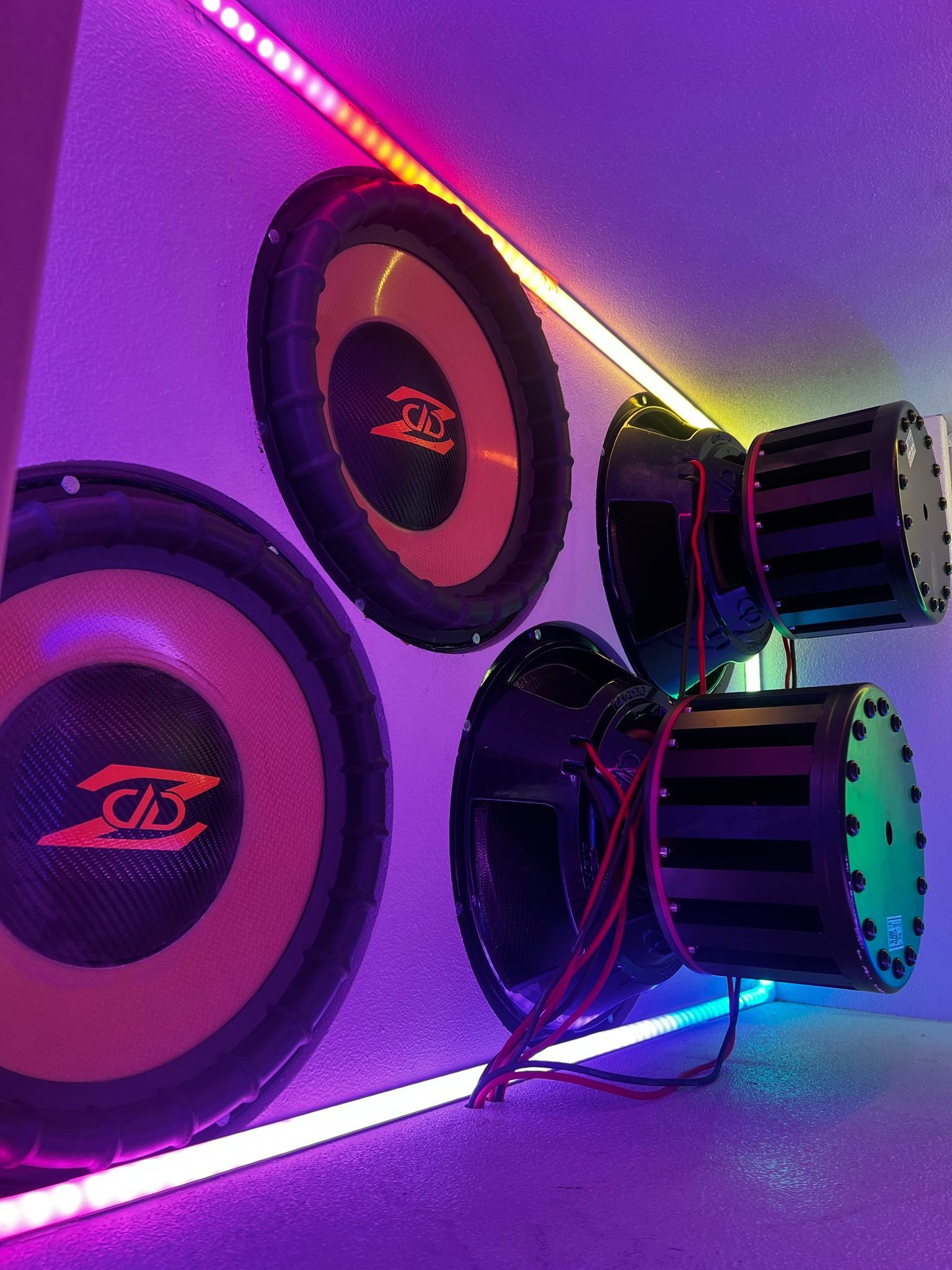 A couple of speakers sitting next to each other on a wall.