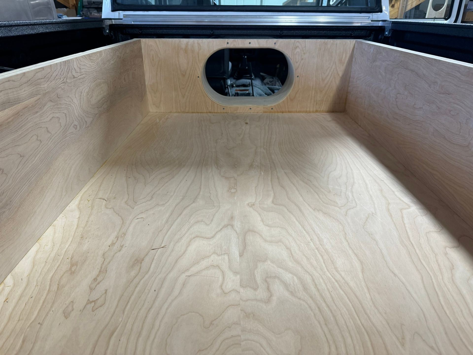 A wooden box with a hole in the middle of it