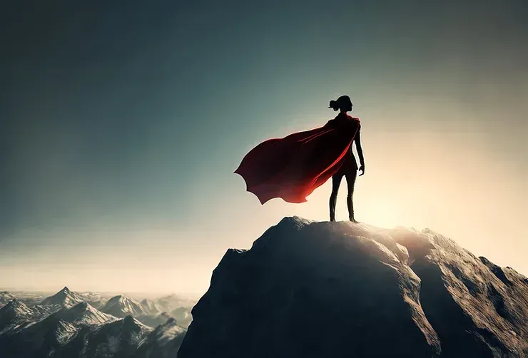Superhero standing alone on a mountaintop