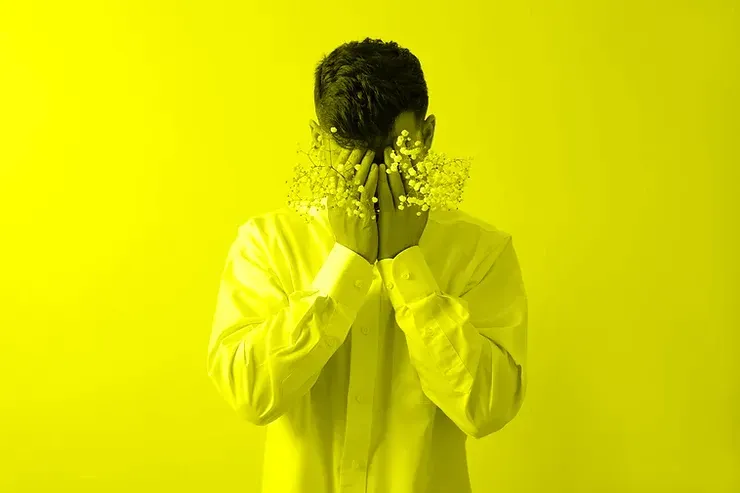 Kid with anxiety covering his eyes