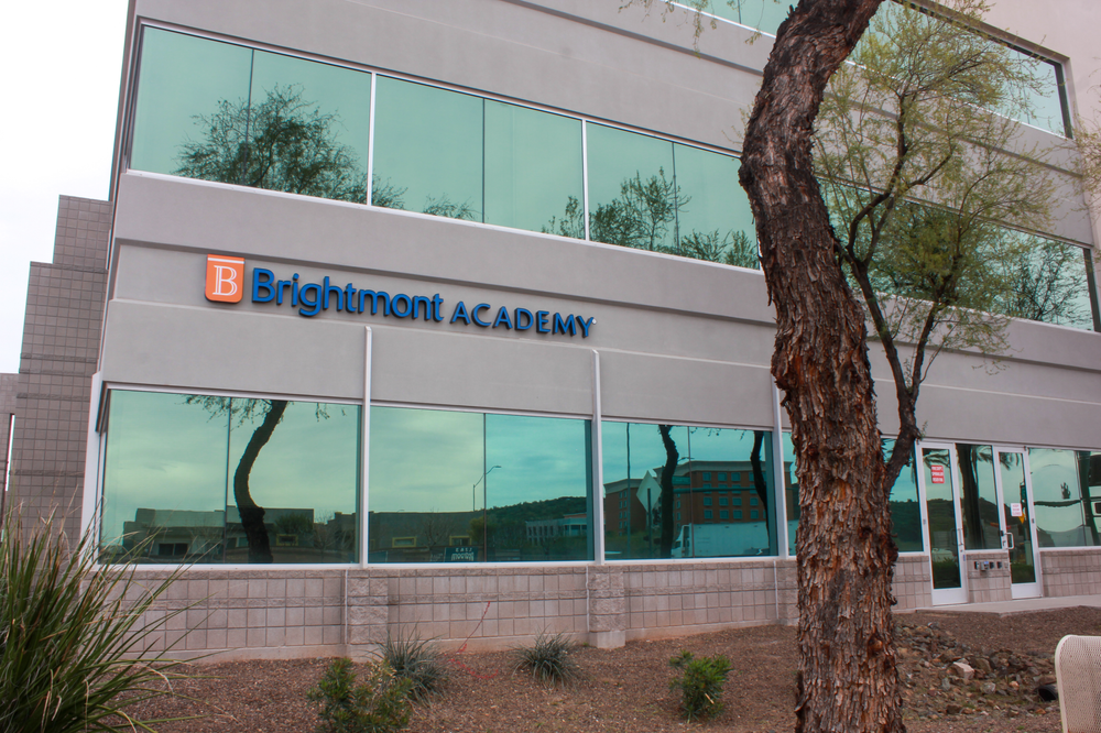 A brightmont academy building with a tree in front of it