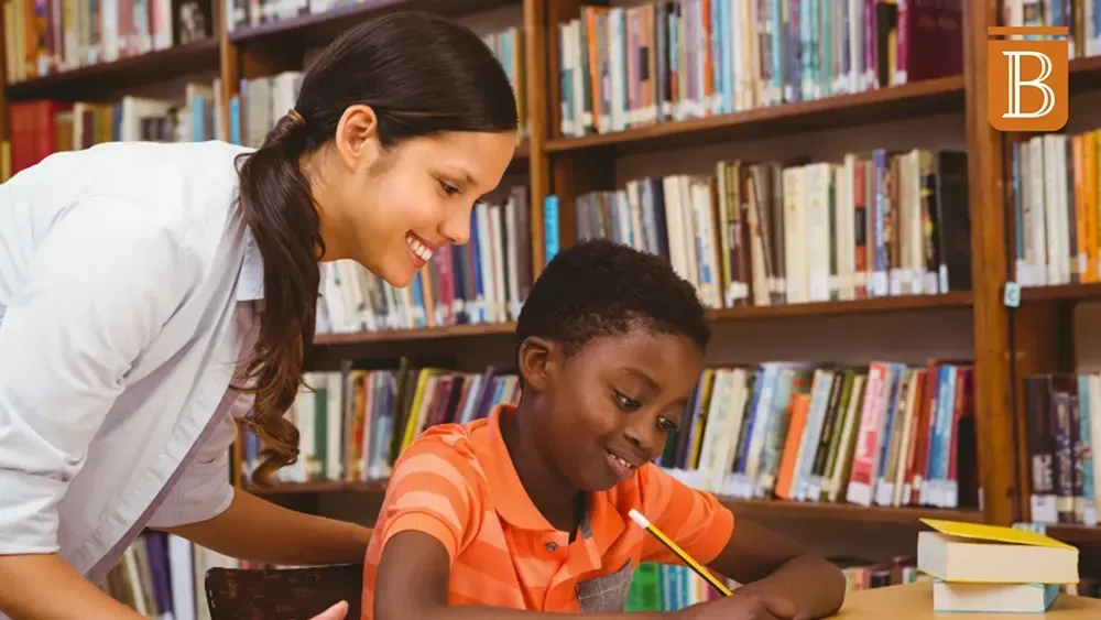 student and teacher working together