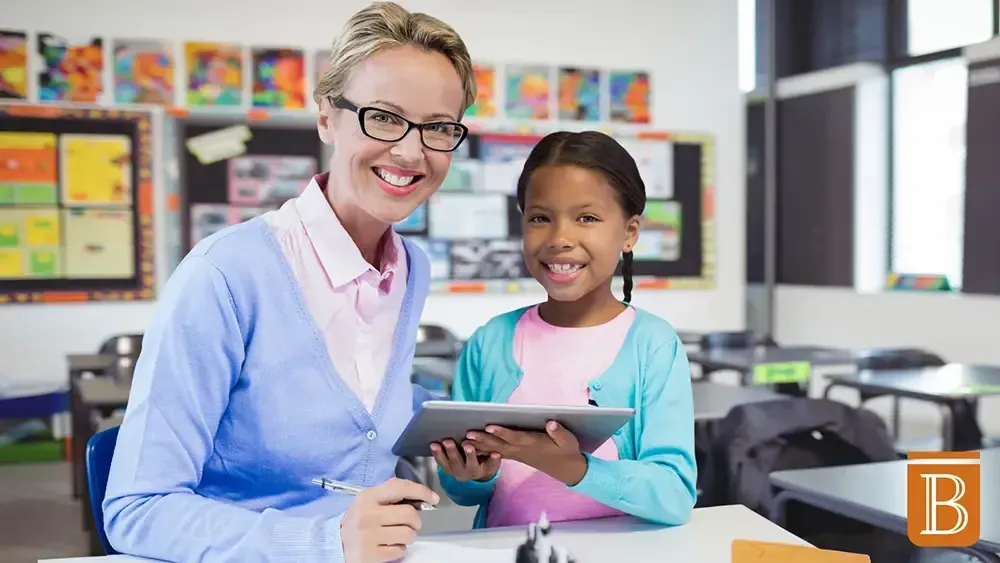 teacher and student smiling