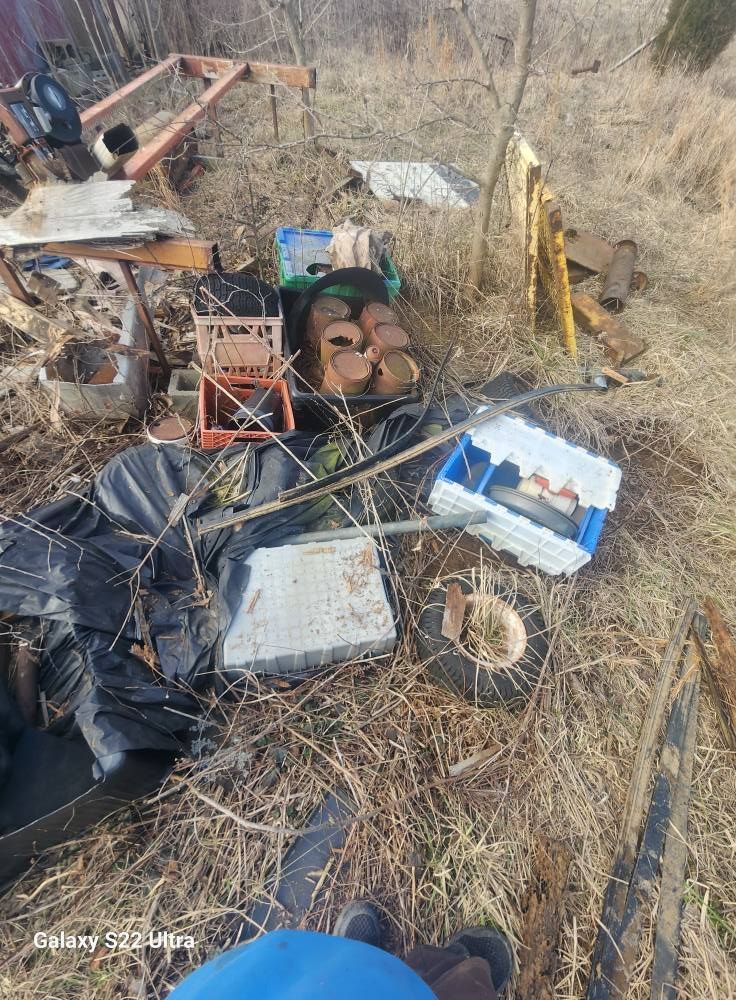 A pile of bricks and rocks on the ground.
