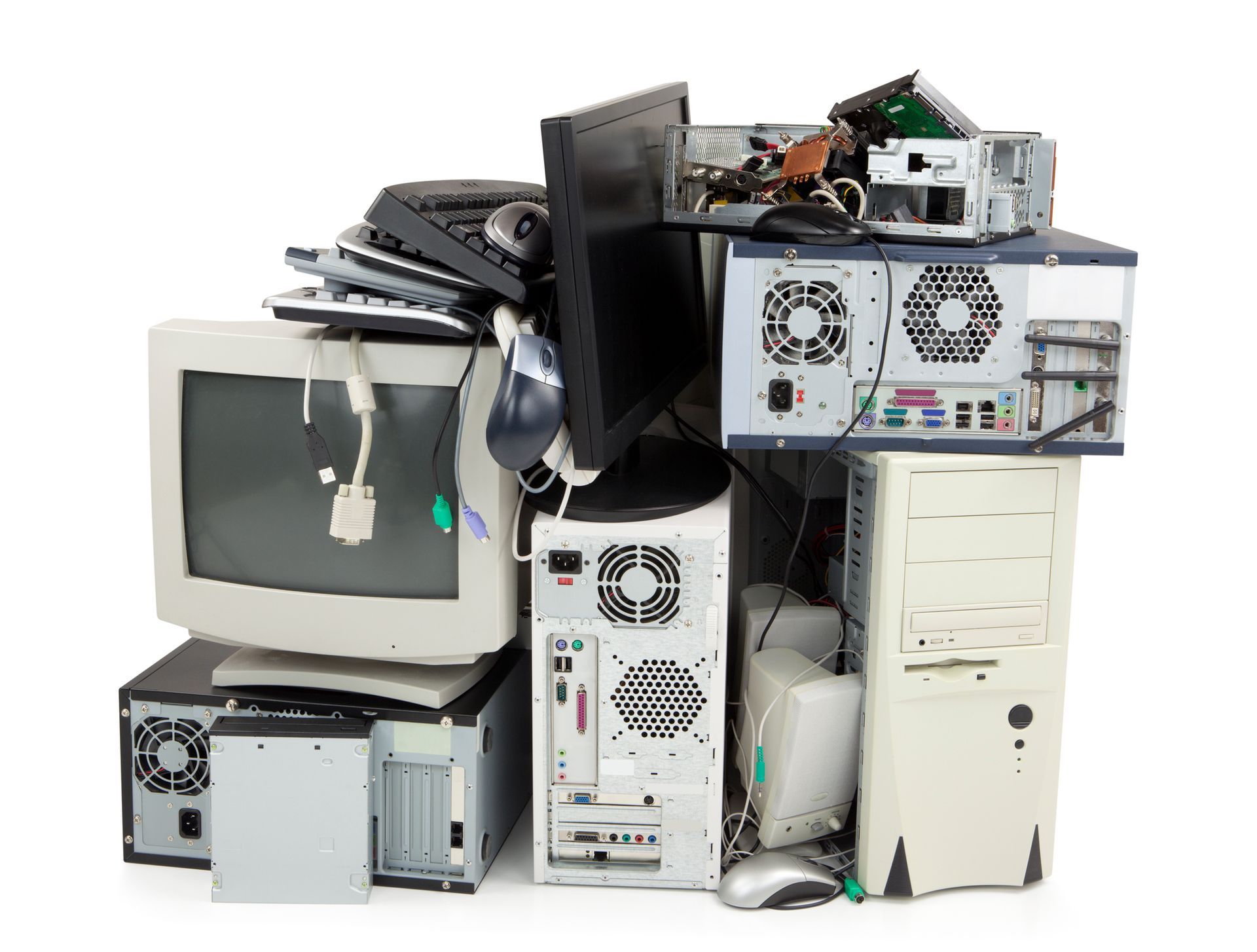 A pile of old computers and monitors on a white background.
