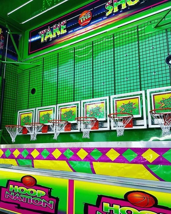 Basketball arcade game with green, pink, and yellow accents;