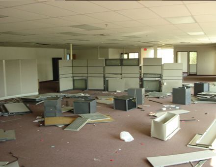 An empty room with a lot of pieces of furniture on the floor