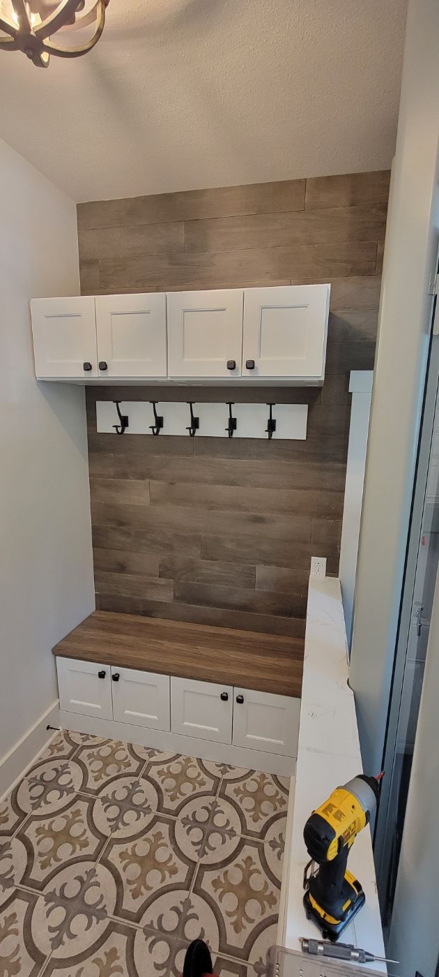 a room with a bench and a drill in it .