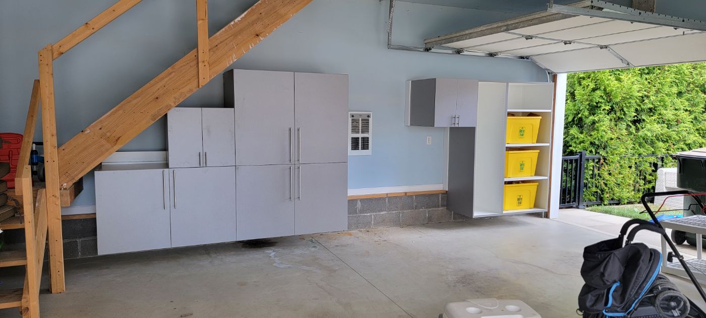 a garage with a staircase leading up to the second floor .