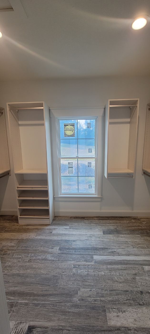 there is a large window in the middle of the room .