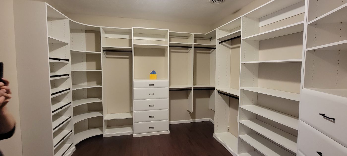 a picture of a walk in closet .