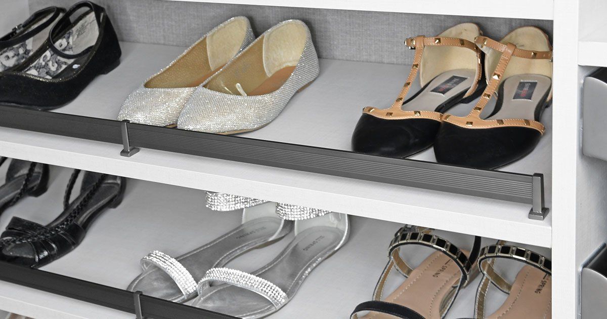 A closet filled with lots of shoes and sandals.