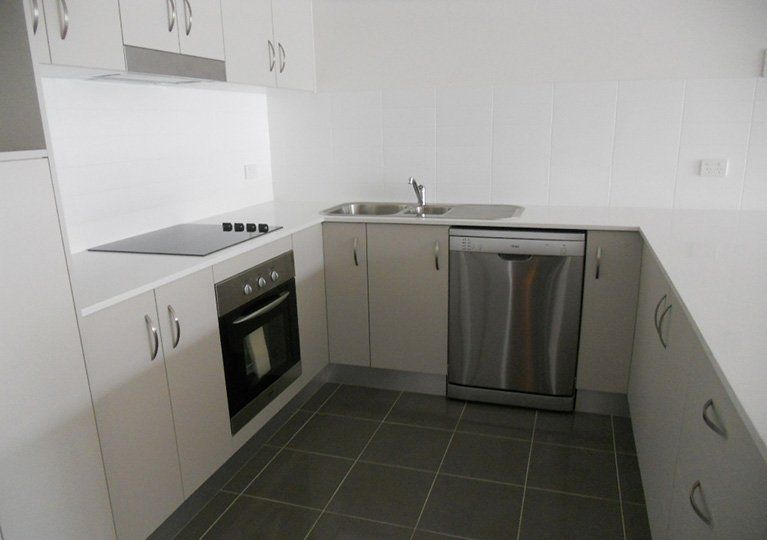 sparkling clean kitchen with stainless steel appliances