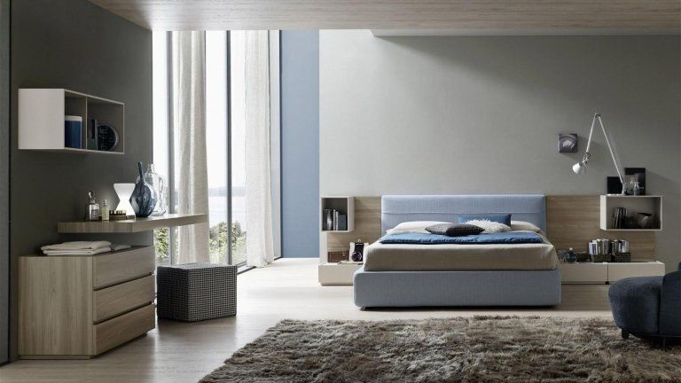 camera da letto con arredi celesti e grigi