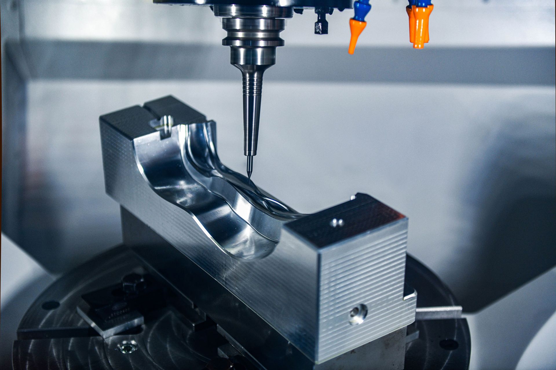 A machine is cutting a piece of metal on a table. A machine is cutting a piece of metal on a table.