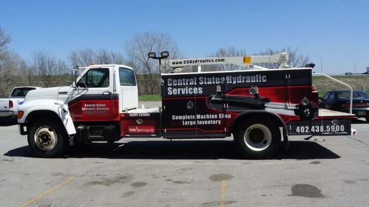 A Red And White Truck Is Parked — Lincoln, NE — Central States Hydraulic Services A Red And White Truck Is Parked — Lincoln, NE — Central States Hydraulic Services